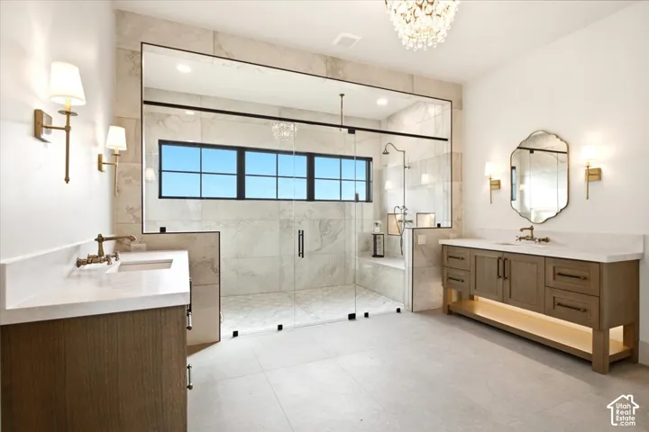 Owner's bathroom shower featuring multiple built-in niches, and a functional integrated bench, and views of Mount Timpanogos and Jordanelle Reservoir