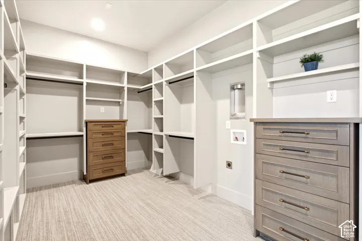Owner's closet featuring a place for a washer/dryer