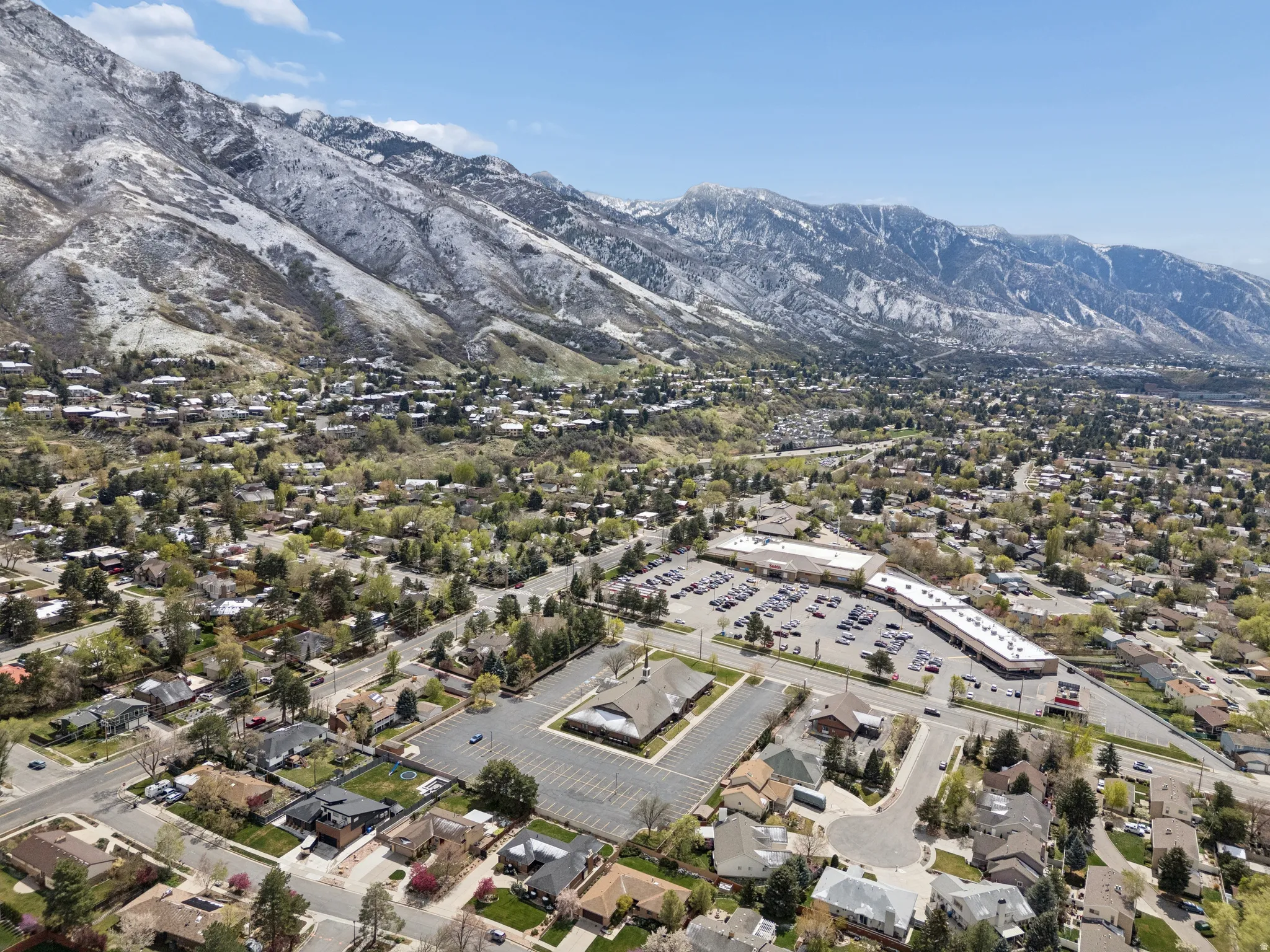 Expansive mountain range backdrop featuring snow-capped peaks.