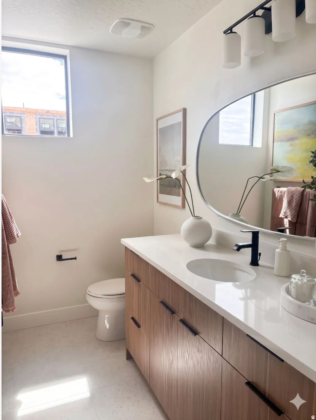 Contemporary bathroom featuring a wood-finish vanity with dark hardware, a white countertop with an integrated sink, and a matte black faucet