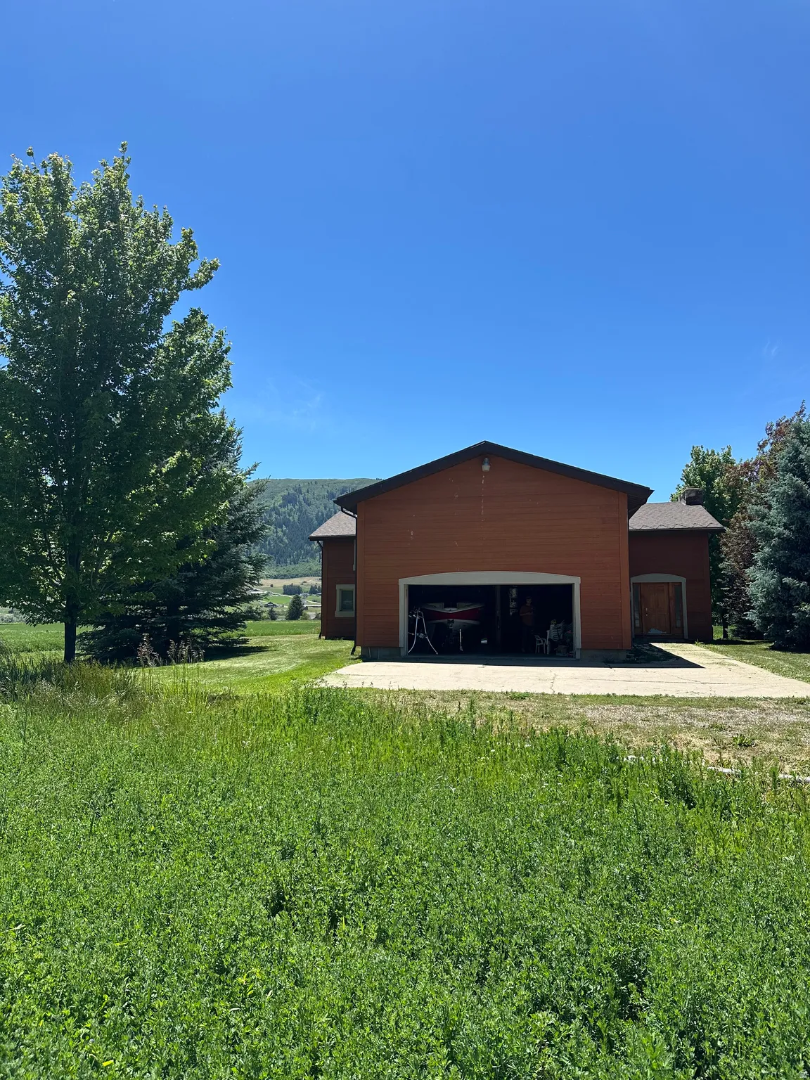 Attached two-car garage with a concrete driveway