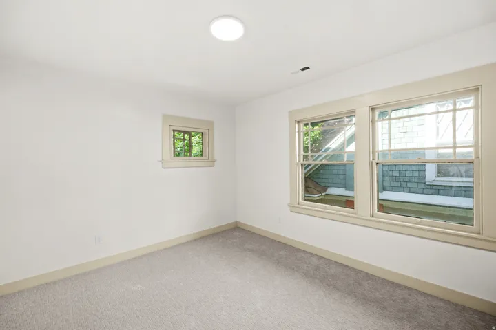 Freshly painted interior with light gray carpeting and white walls