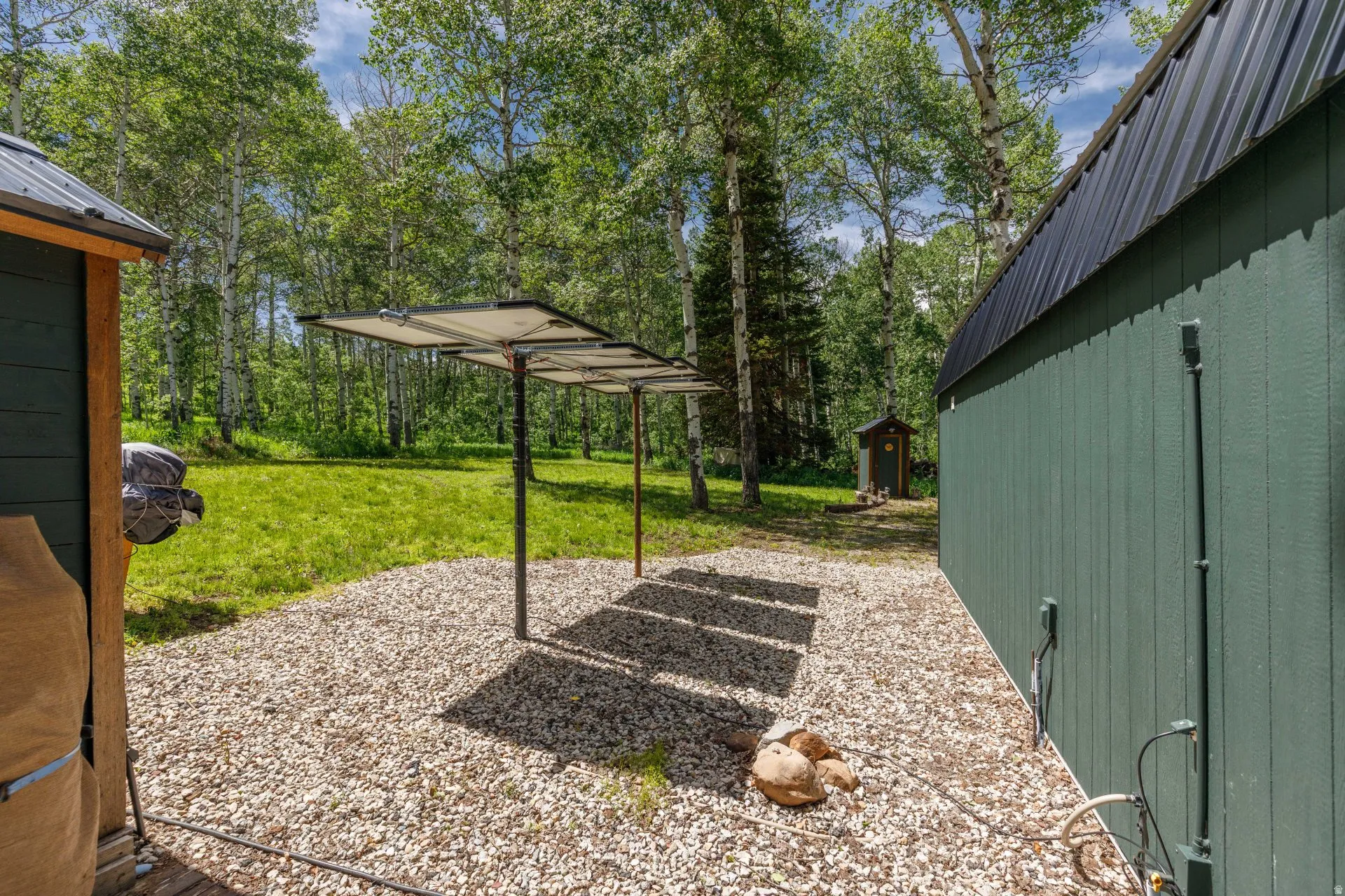 Gravel outdoor area featuring a solar panel array