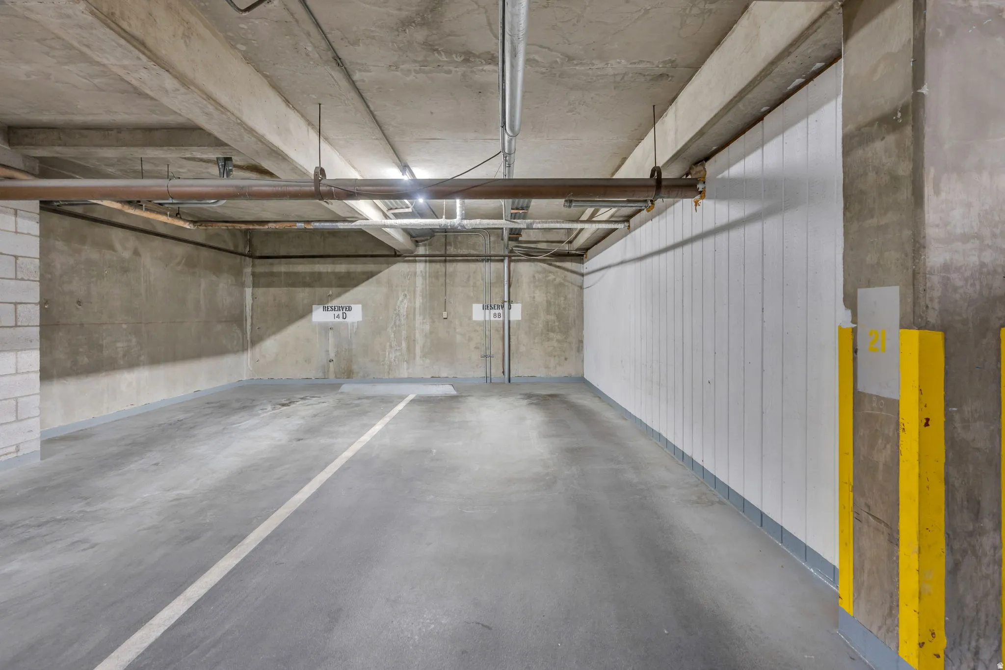 Dedicated parking space with concrete flooring