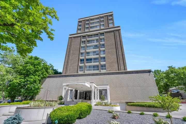 High-rise building featuring brick and concrete construction with multiple balconies