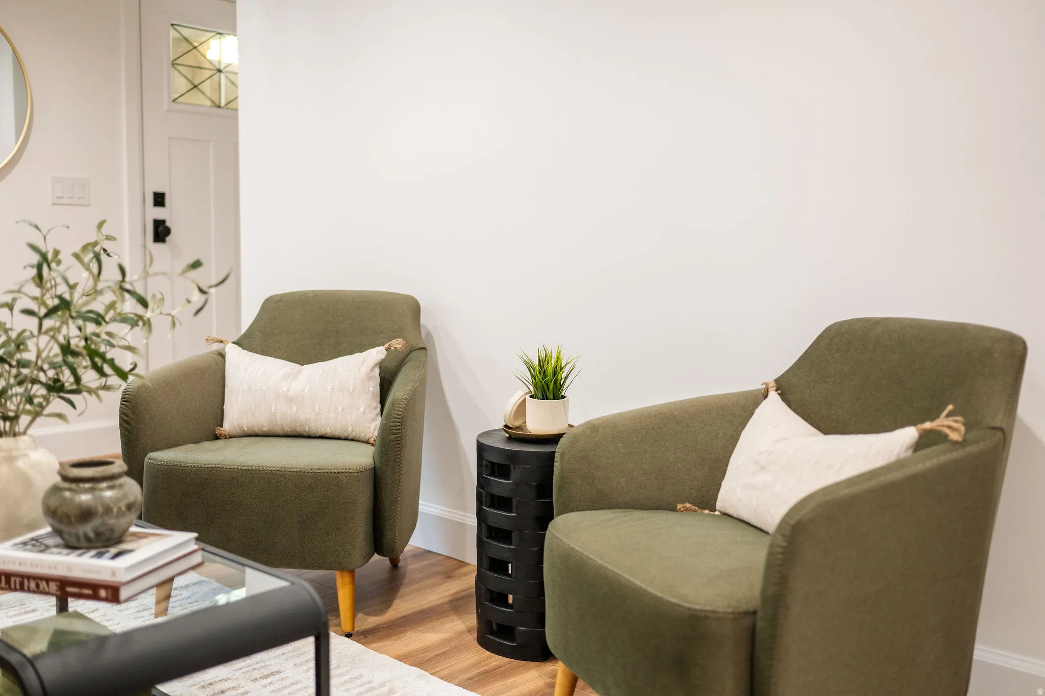 Interior space featuring wood-finish flooring and white walls