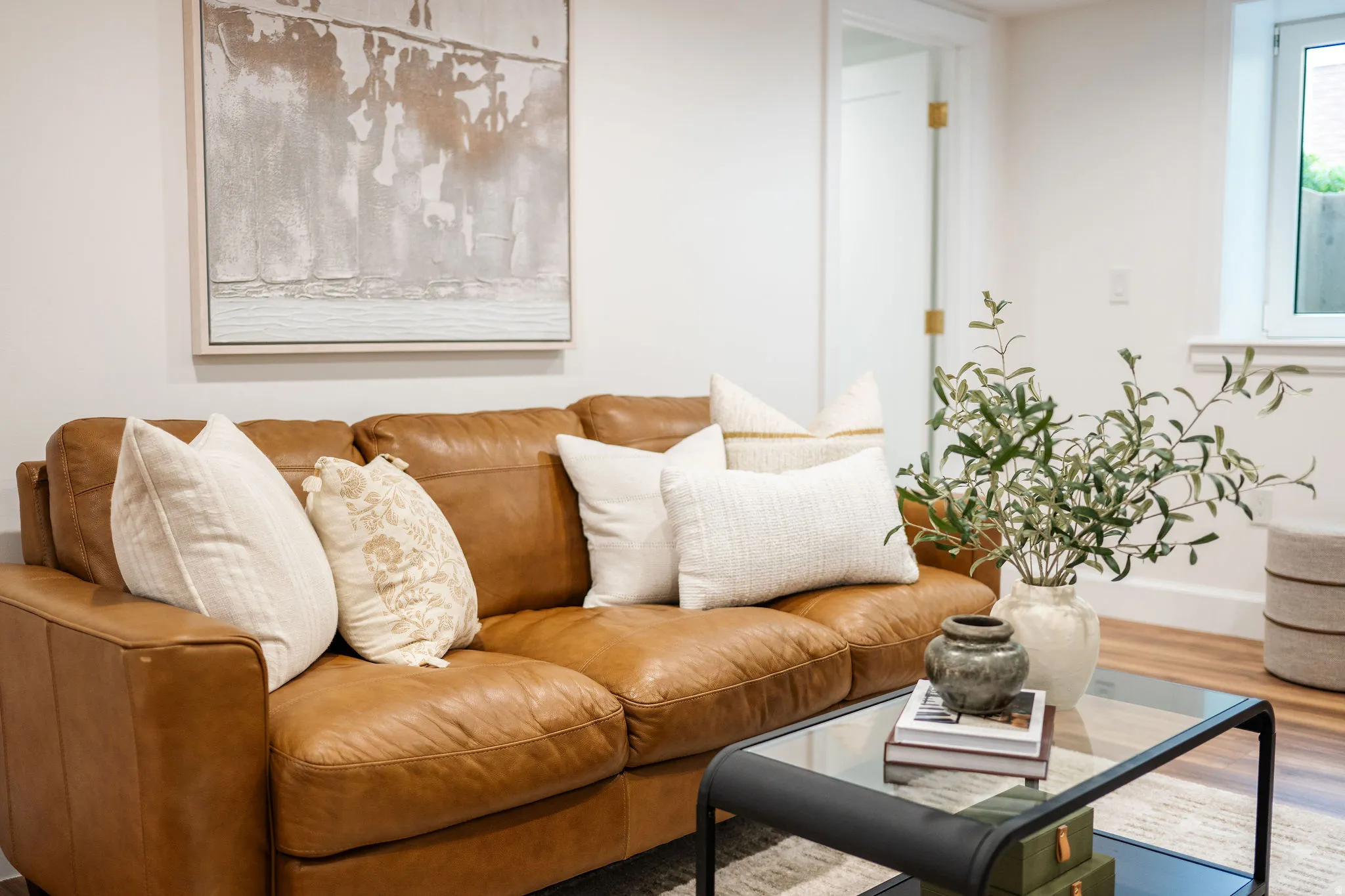 White walls complement the light wood-finish flooring