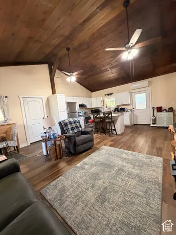 Vaulted wood-plank ceiling with dual ceiling fans