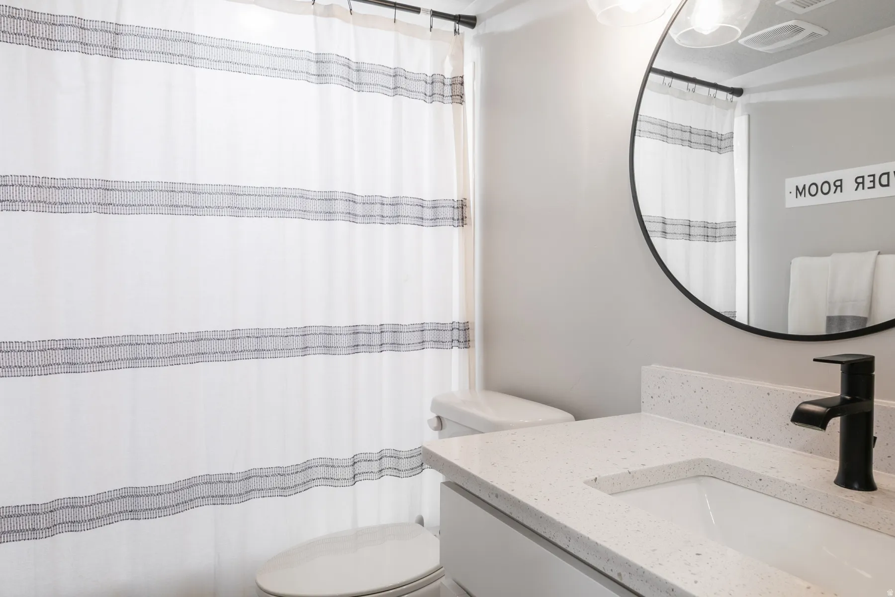 Bathroom vanity with a white countertop and integrated sink