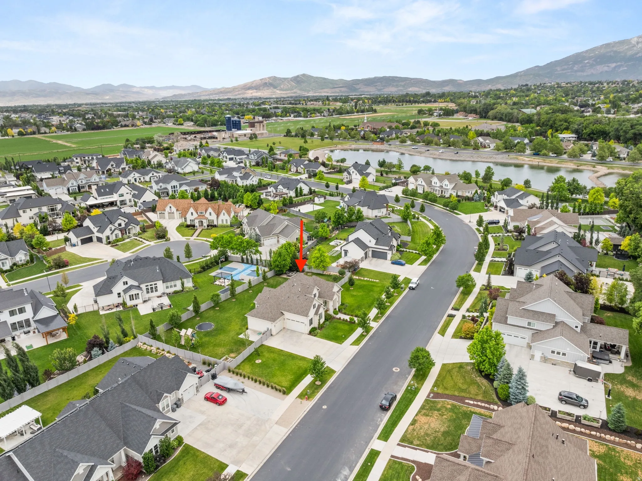 Aerial view of a residential neighborhood with mountain backdrop