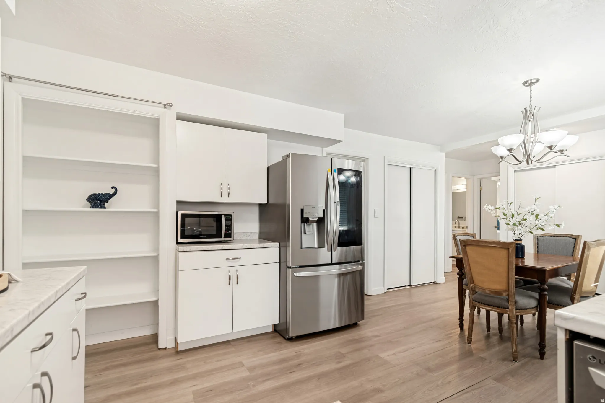 Open-concept living area with wood-finish flooring