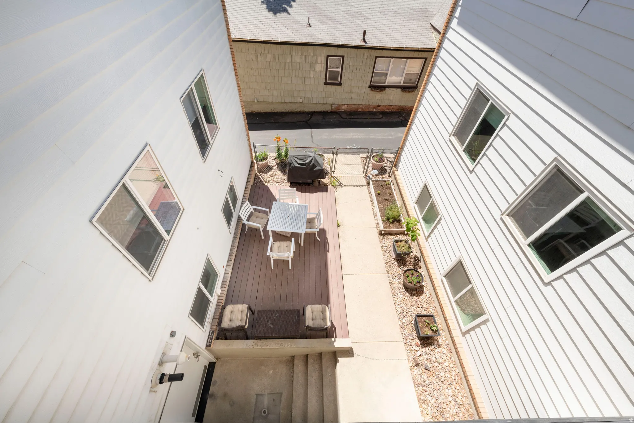Outdoor decking area featuring a spacious dining arrangement