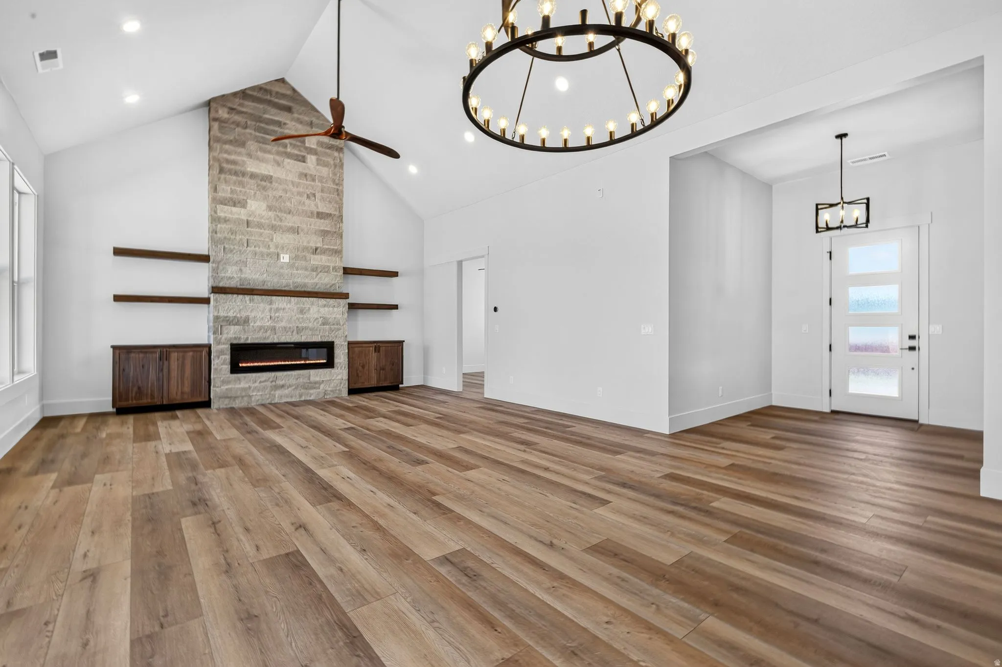 Vaulted ceiling great room with laminate flooring