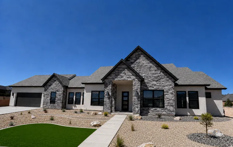 Contemporary single-story residence with stone and stucco exterior
