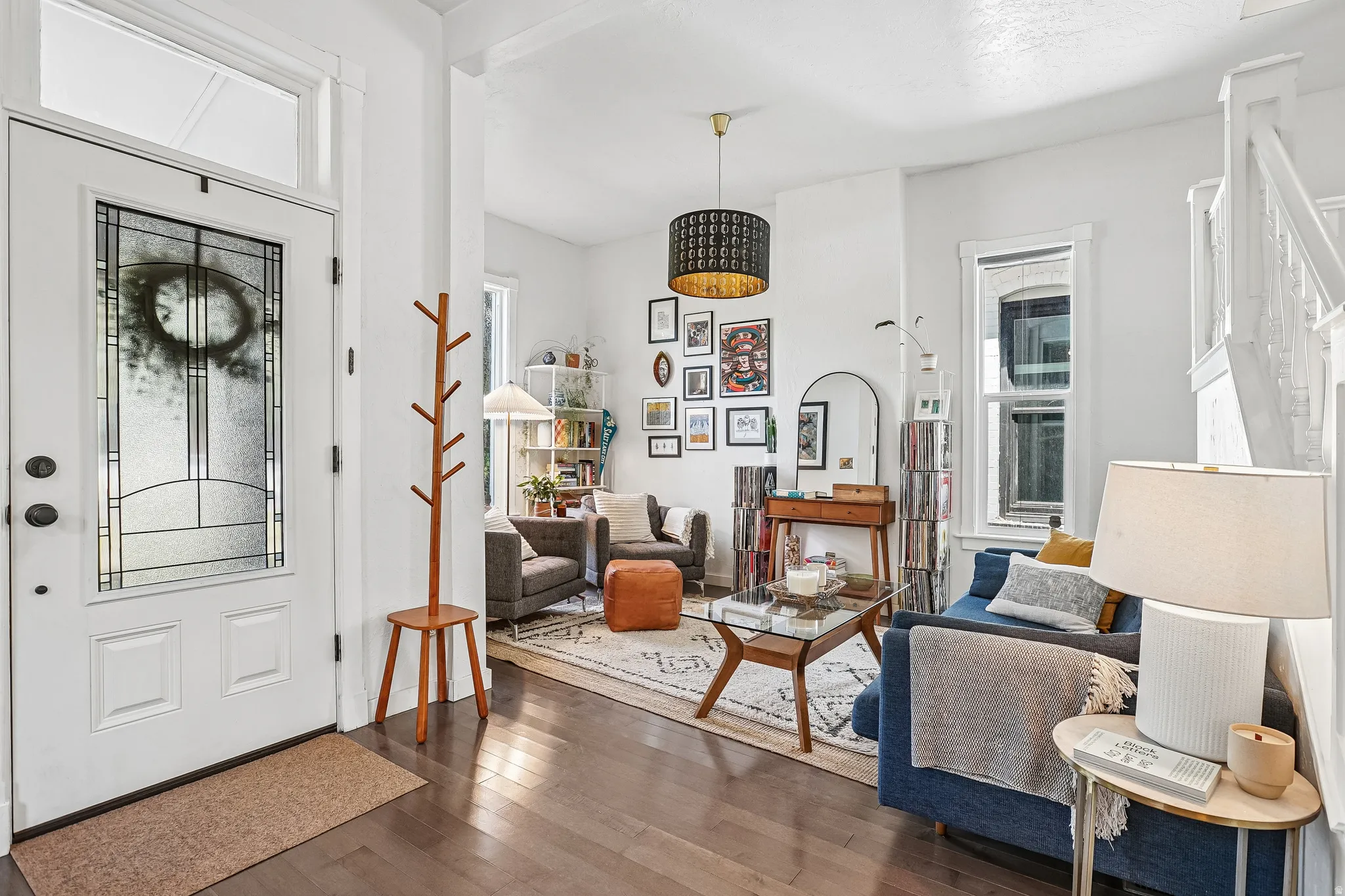 Entryway featuring a white door with decorative glass inserts and a transom window