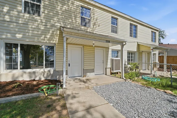 Two-story exterior with light-colored siding