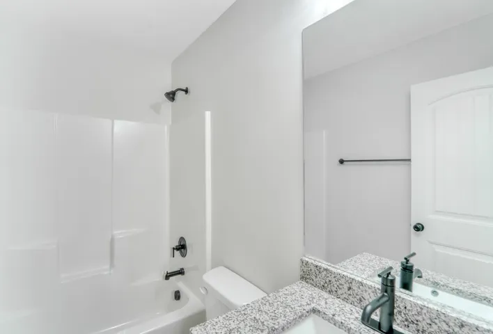 Photos are of a previously built home of the same floor plan. Finishes, colors, features, and upgrades may vary. Bathroom