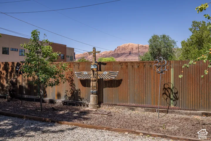 Corrugated metal fencing defines the property perimeter