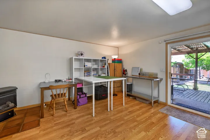 Warm wood-finish flooring complements light-toned walls