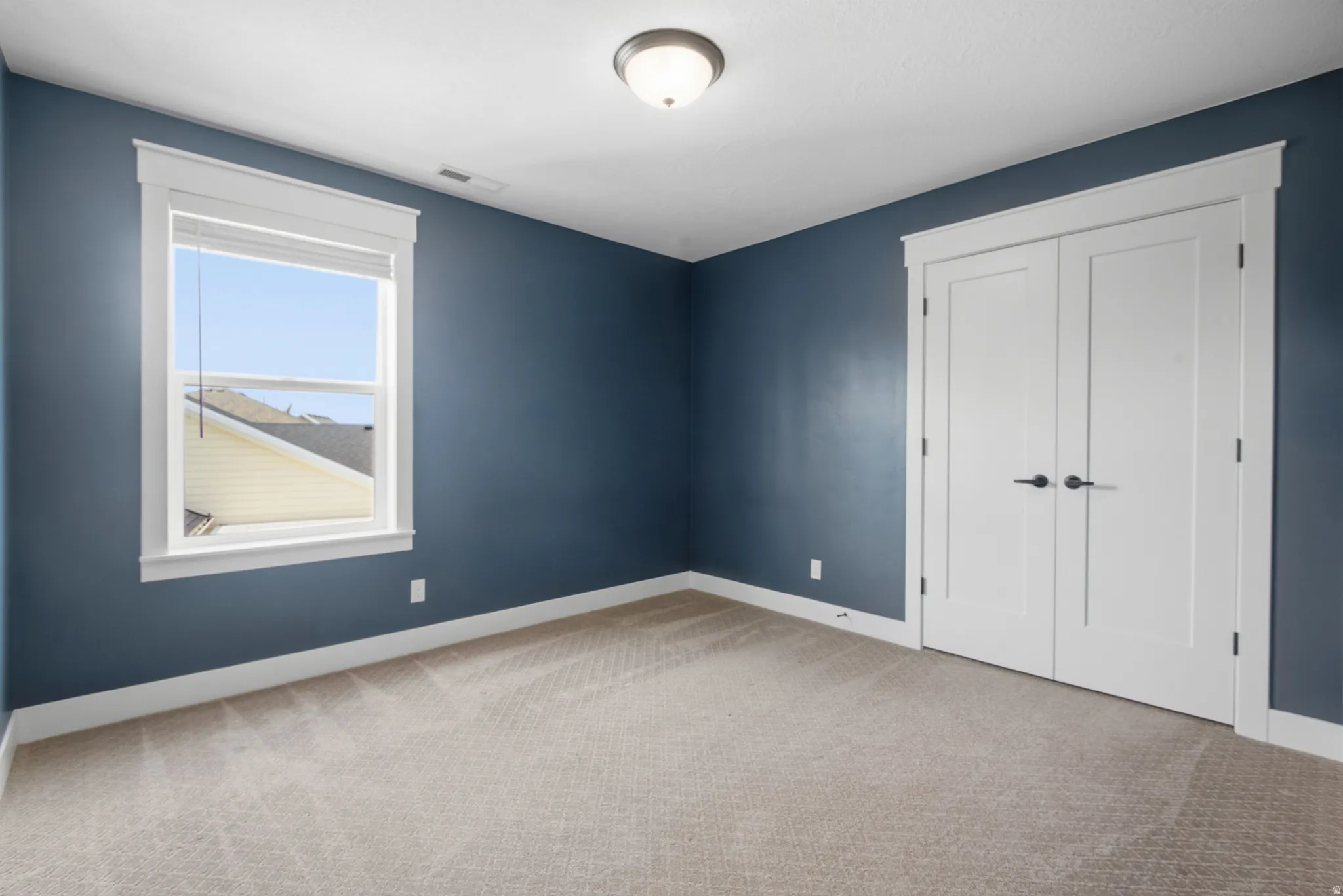 Bedroom 3 Neutral carpet flooring with light-toned walls
