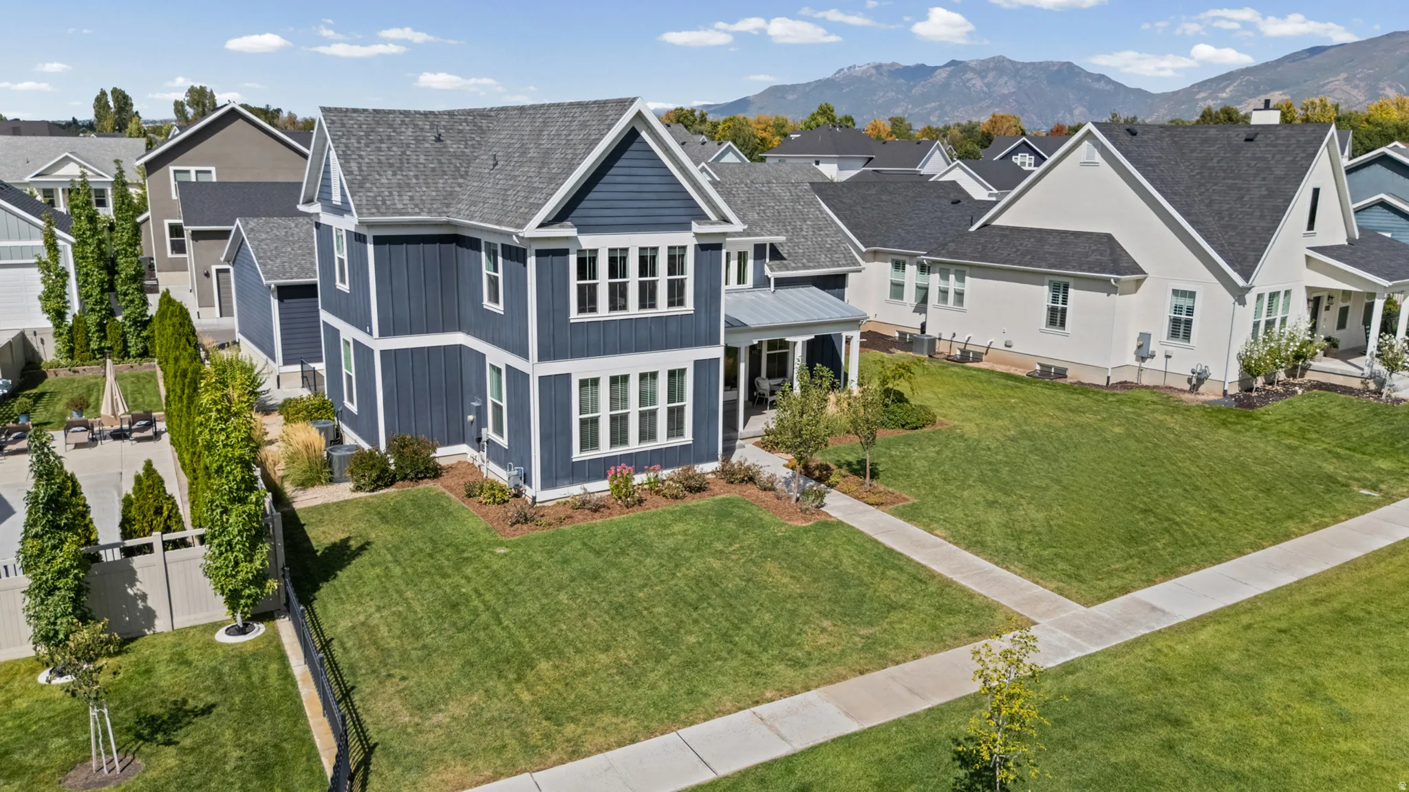 Two-story residence with blue siding and white trim