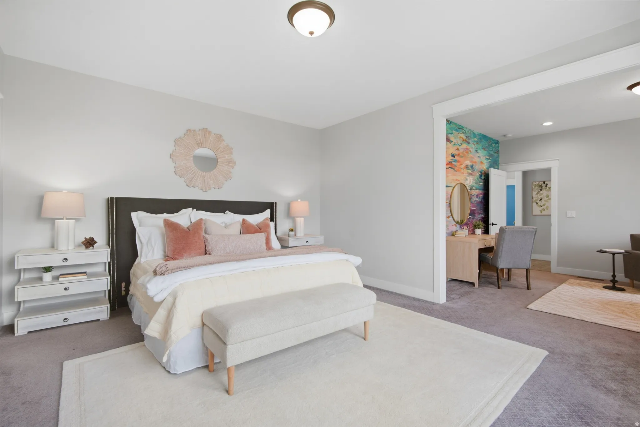 Primary Bedroom. Neutral-toned walls complement plush carpeting