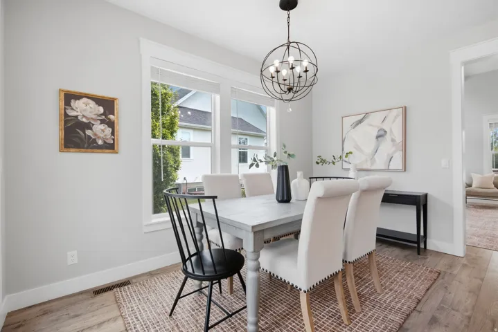 Recessed lighting, wood-finish flooring, and crisp white trim