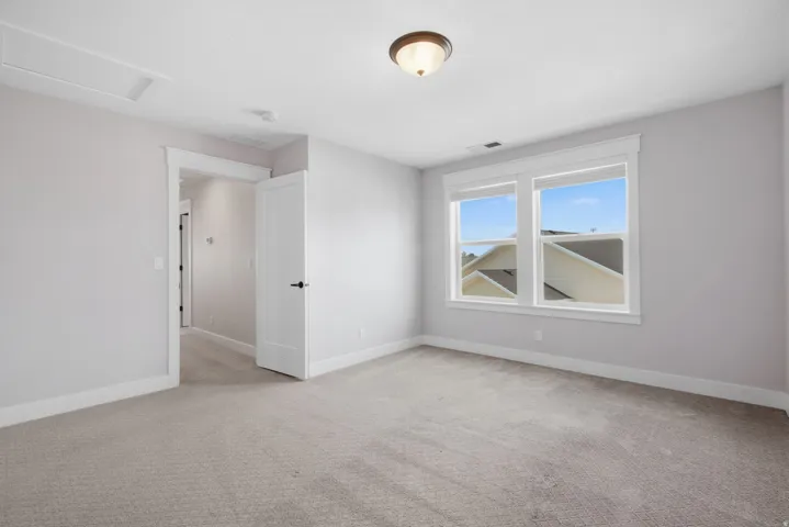 Bedroom 4 Recessed lighting, light gray carpet, and white trim