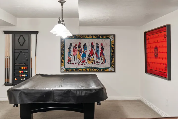 Recreation room with carpeted flooring and white painted walls
