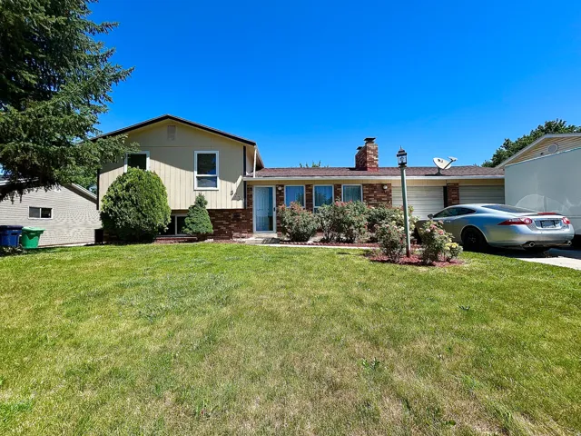 featuring a brick and siding exterior