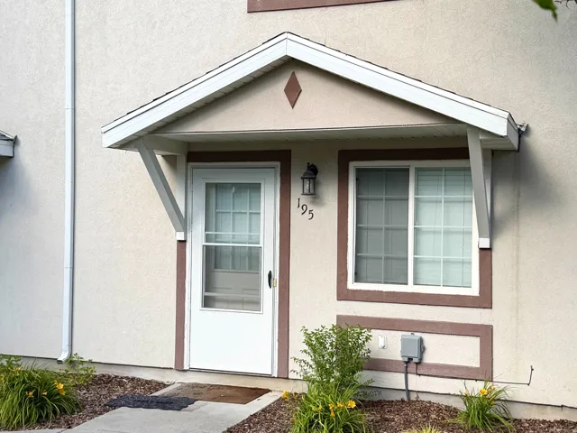 Stucco exterior with contrasting trim details