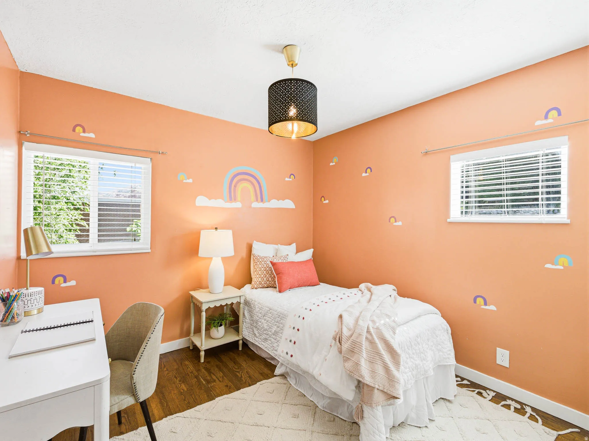 This room features a neutral color palette with warm orange walls and white trim