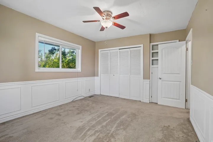 Interior room featuring neutral-toned walls and plush carpeting