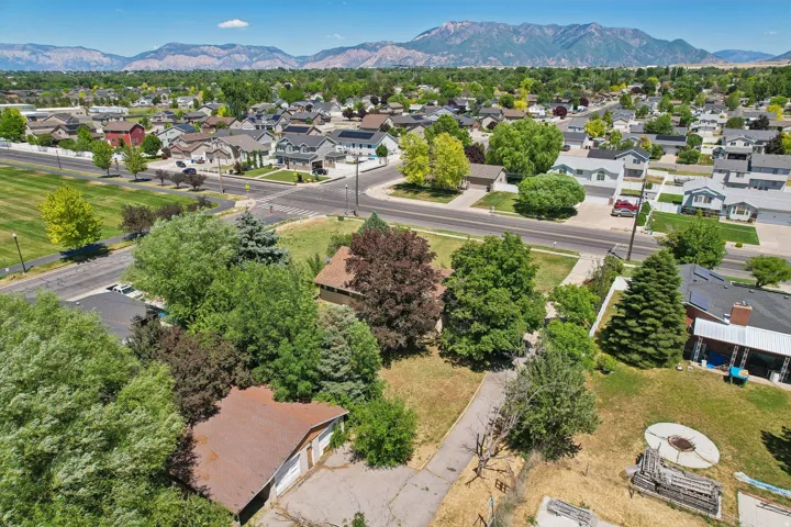 Expansive lot with mature trees and a detached garage structure