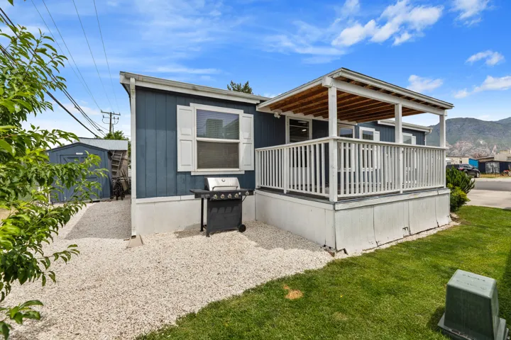 Exterior featuring blue siding and white trim