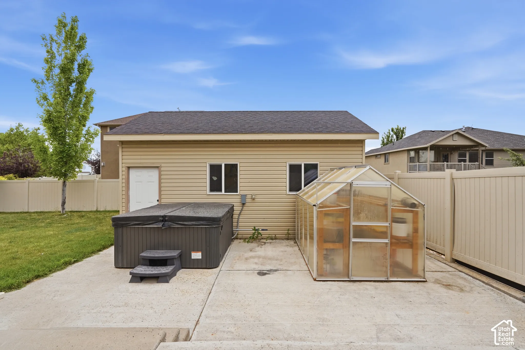 Detached structure with siding exterior and asphalt shingle roof