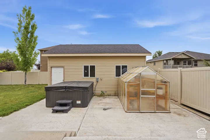 Detached structure with siding exterior and asphalt shingle roof