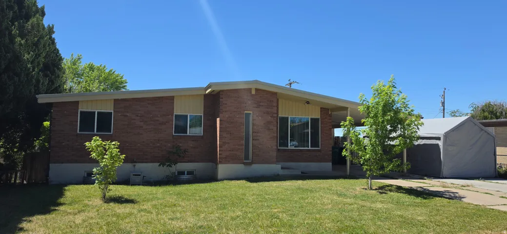 Brick exterior with a complementary light-colored fascia and soffit