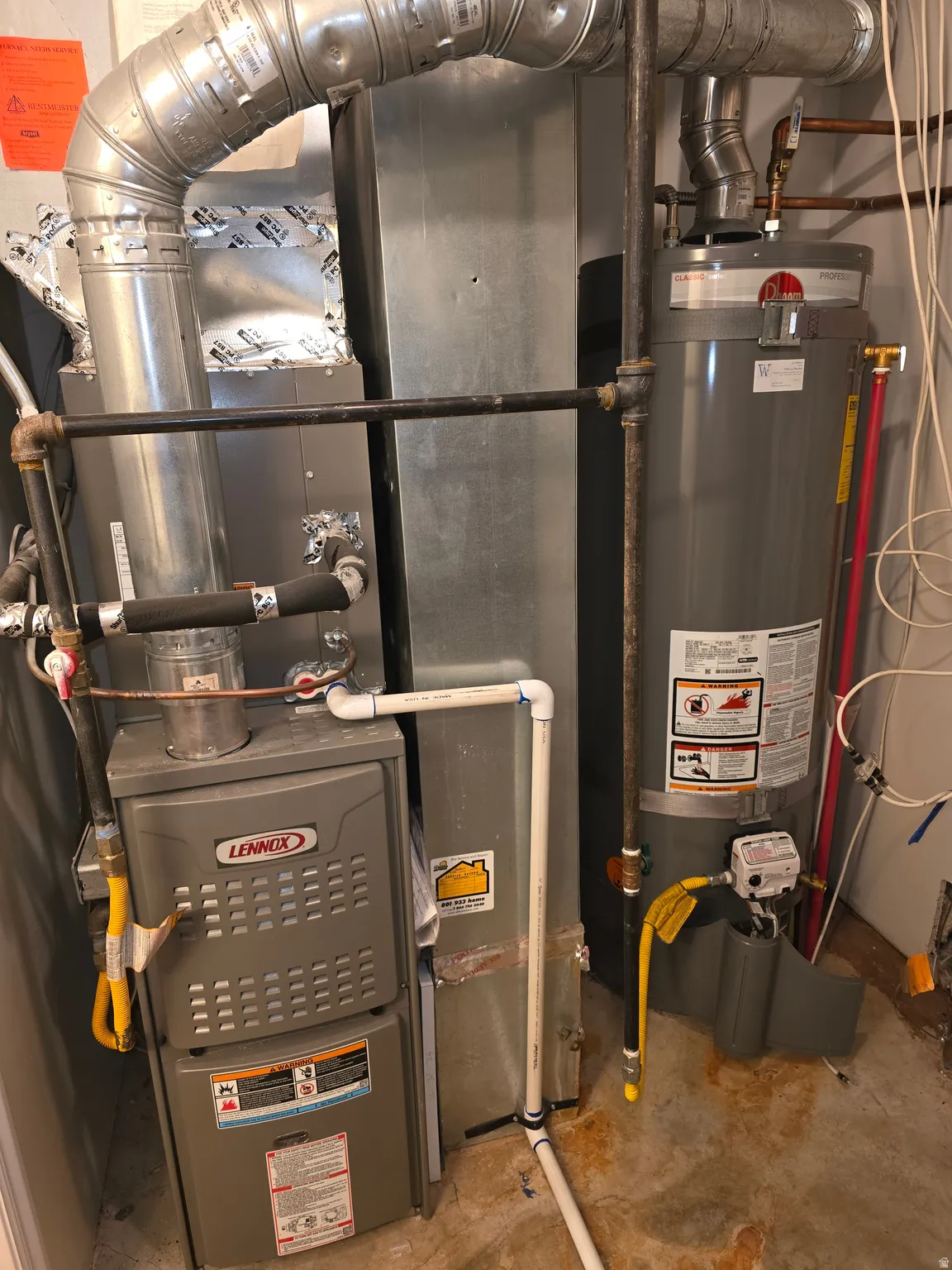 Lennox furnace and Rheem water heater with associated ductwork and piping