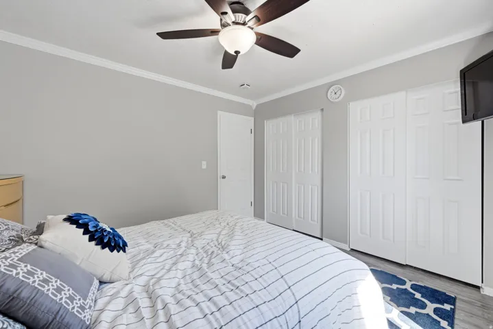Interior room featuring crown molding and light gray walls