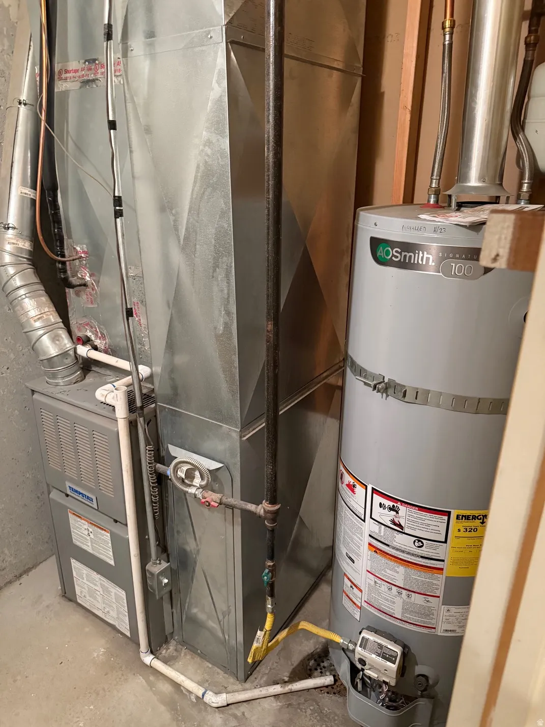 Water heater and furnace with associated ductwork