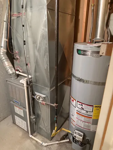 Water heater and furnace with associated ductwork