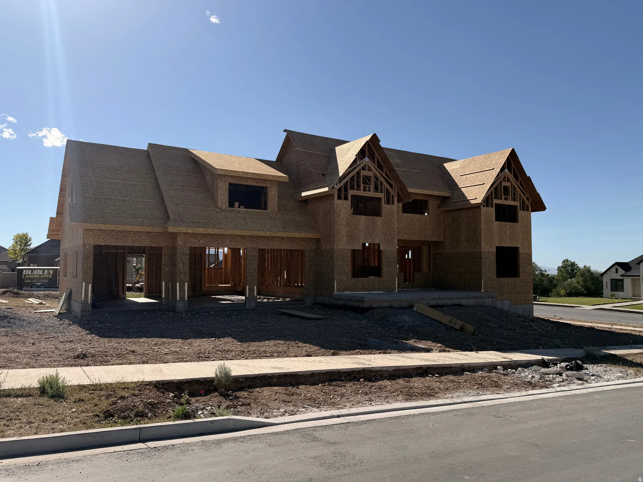 New construction home framed with oriented strand board and a shingled roof