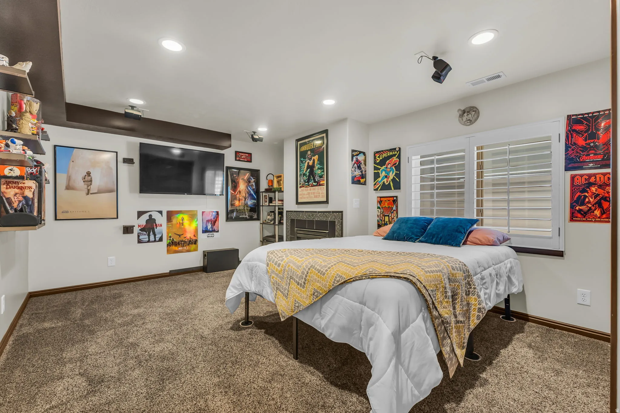 Carpeted room featuring recessed lighting and a mounted television