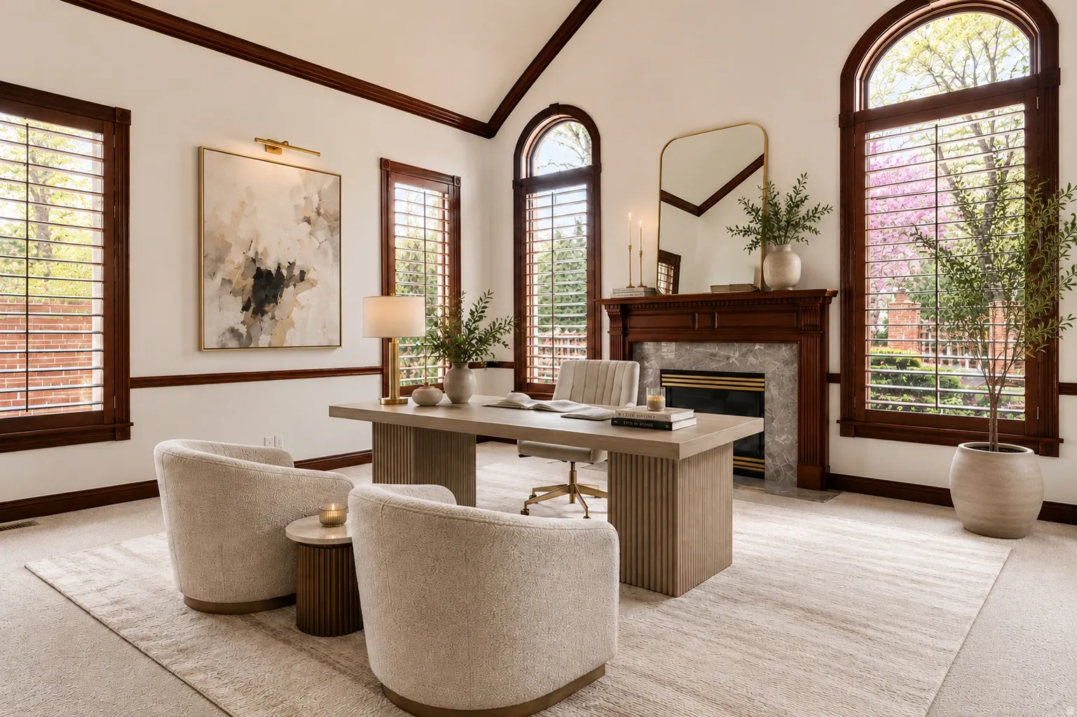 Formal office space featuring a vaulted ceiling and rich wood trim