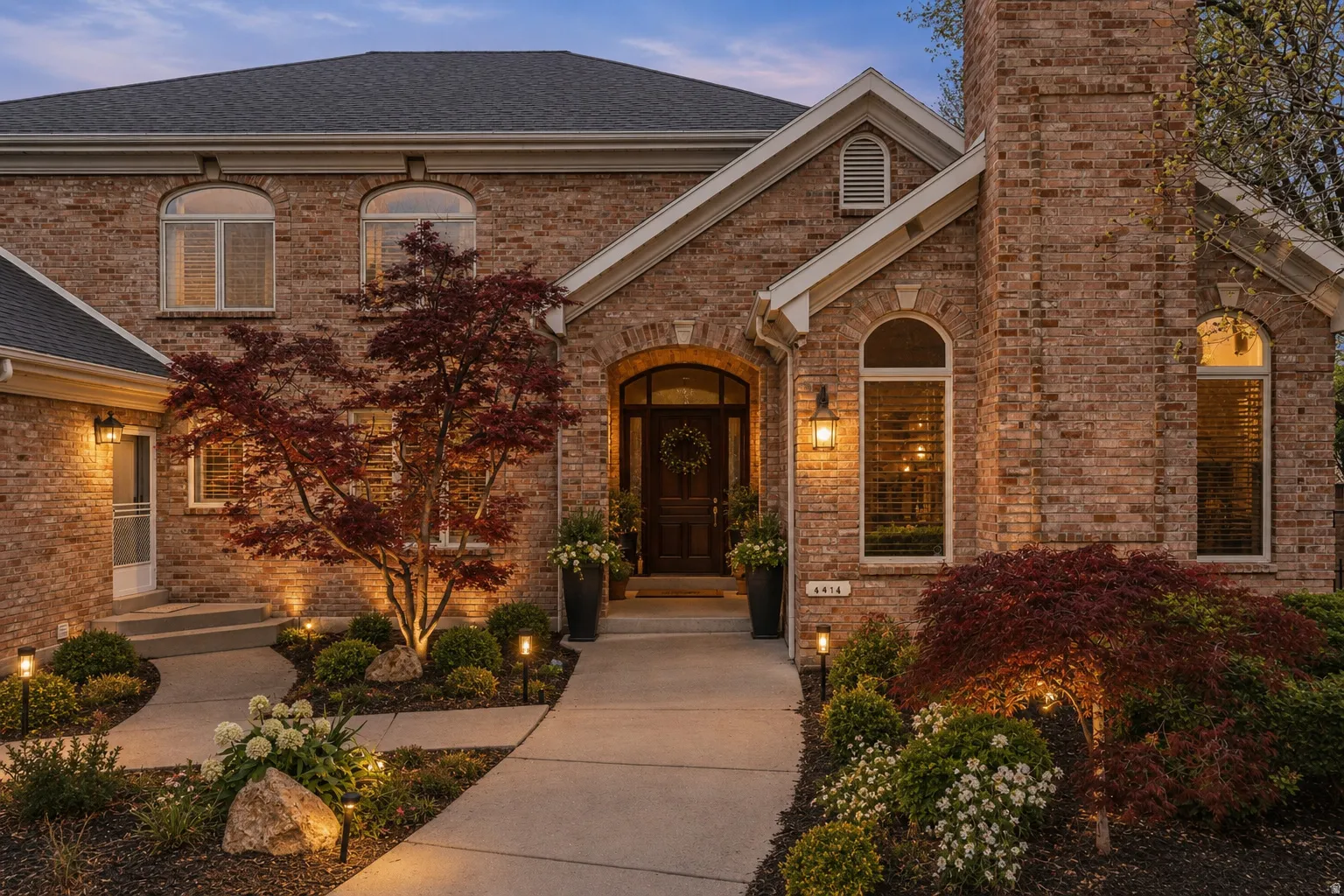 Brick exterior facade featuring architectural arched windows