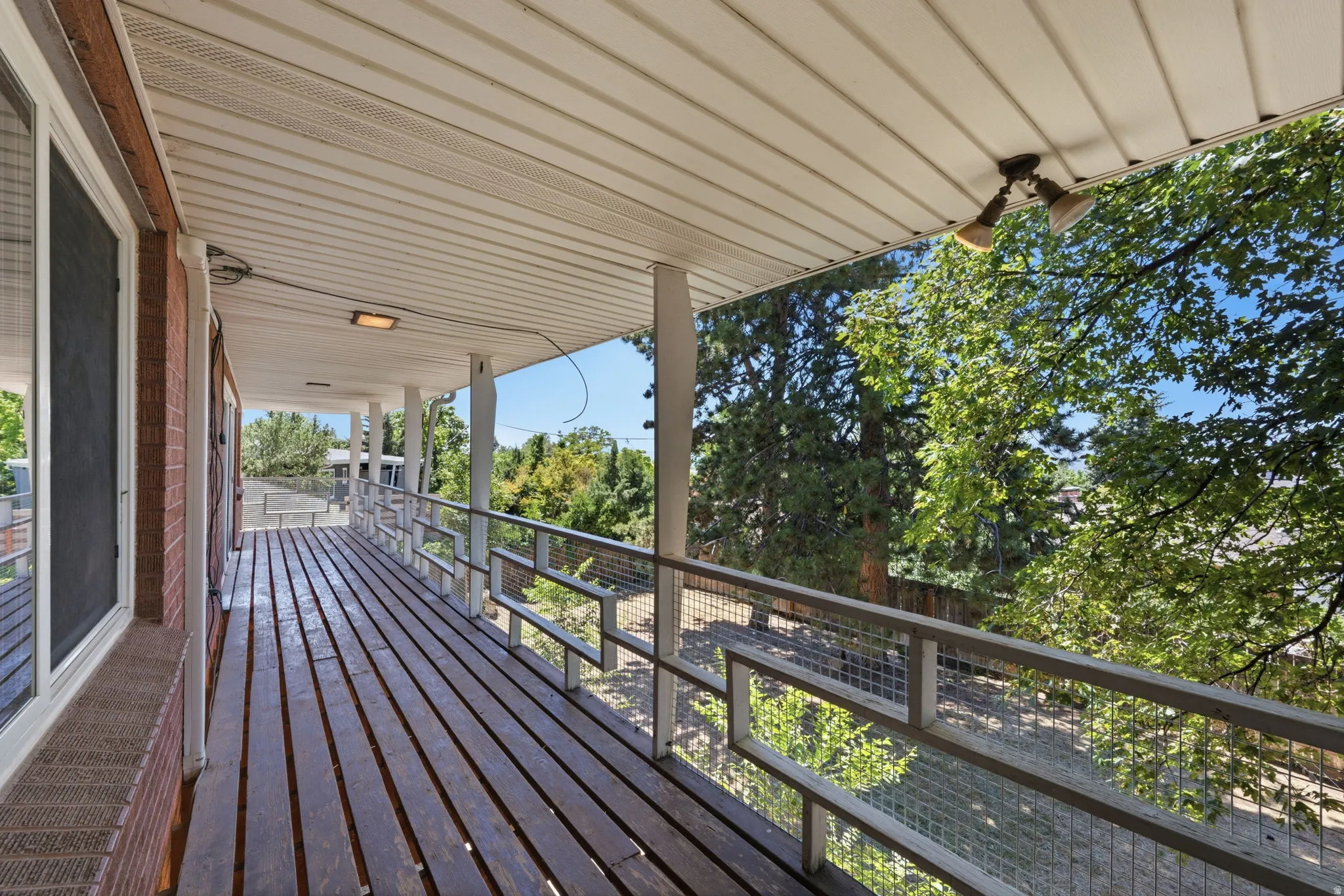 Expansive covered deck with wood-finish flooring
