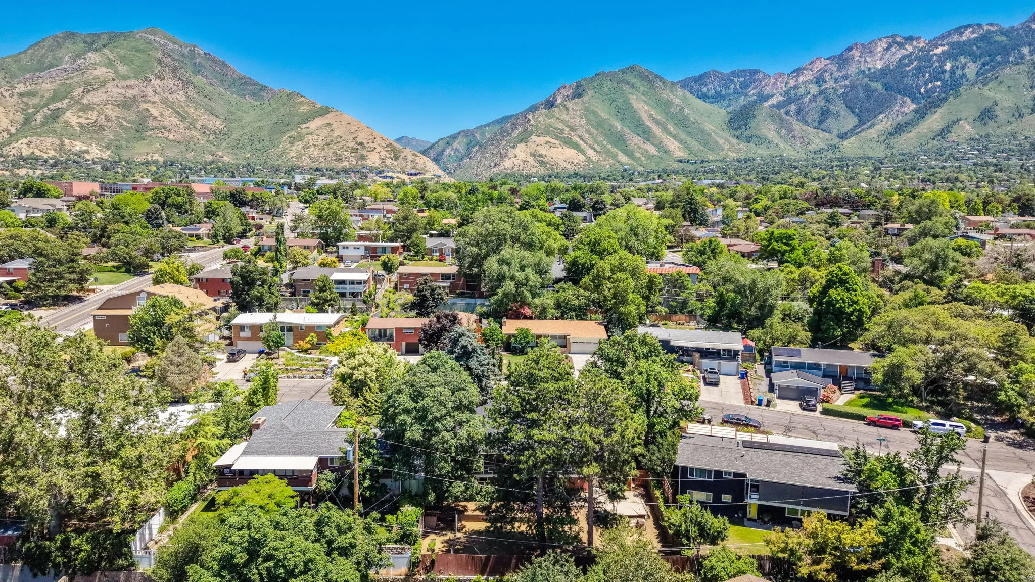Expansive aerial perspective showcasing a residential neighborhood with varied architectural styles