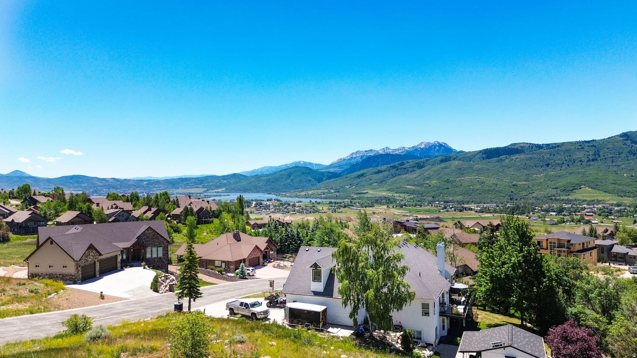 Expansive residential area with mountain and lake scenery