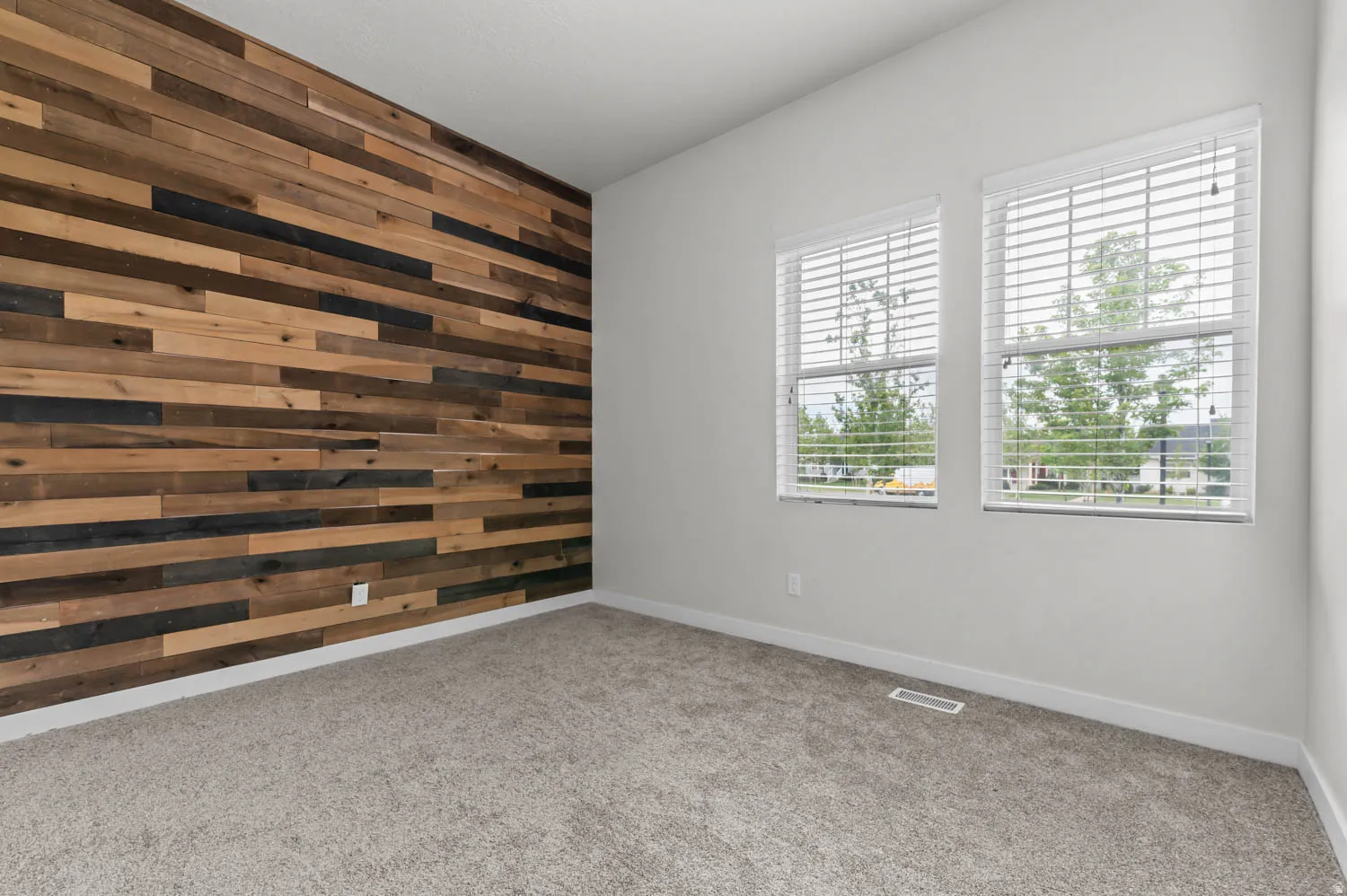 Accent wall featuring varied wood paneling